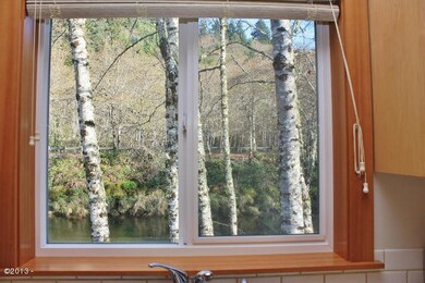 Watch the otters from the kitchen