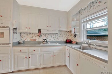 Cabinet Filled Kitchen, loads of counter space, wall oven, ceramic cook top, deep stainless steel sink