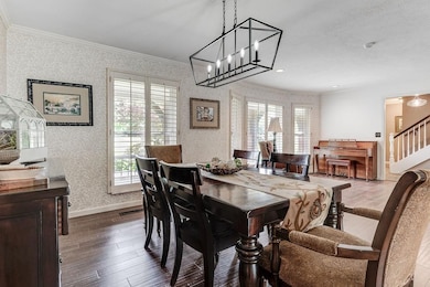 Open dining and living with continuous wood tile f