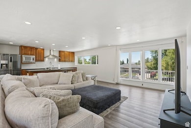 Living room featuring recessed lighting and light wood-type flooring