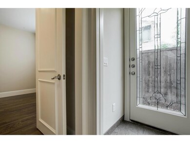 Entry level bedroom with full bath and hardwood fl