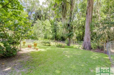 Backyard looks out on lush wooded area