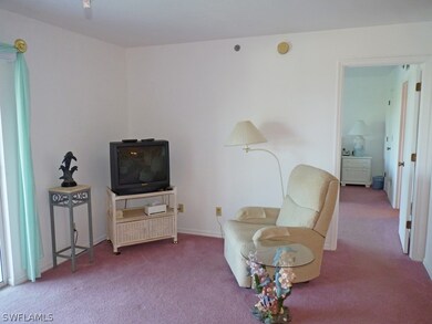 LIVING AREA; ENTRANCE TO MASTER SUITE AT RIGHT