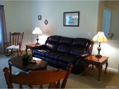 Great Room with neutral carpeting and paint!