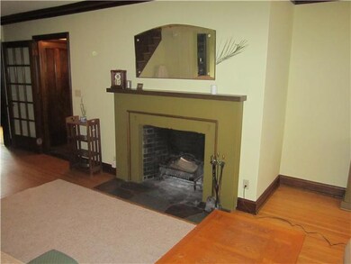 Living Room Hardwood Flooring and a Wood Burning F