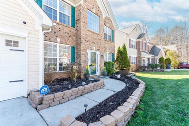 Landscaping pavers line the walkway to the front entry.