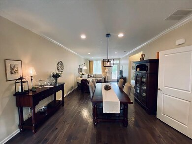 Open floor plan on the first floor with crown mold