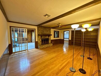 Unfurnished living room with hardwood / wood-style