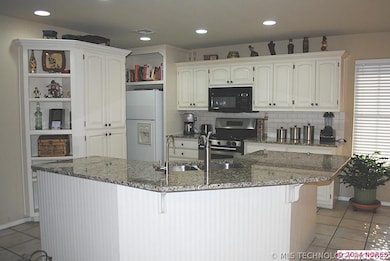 Kitchen has recently been updated with new granite