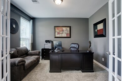 Study at the front of the home with views of the lake across the street.