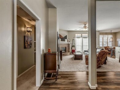 Hall with dark hardwood / wood-style flooring