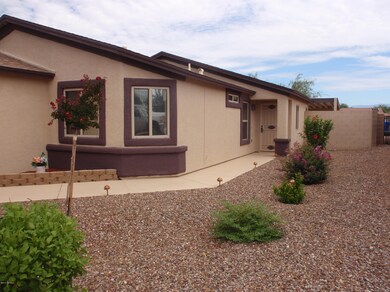 Side entrance with landscaping