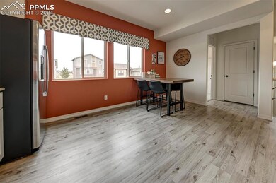 Office area with light wood-type flooring