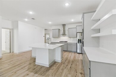 Gourmet kitchen with large island & quartz countertops