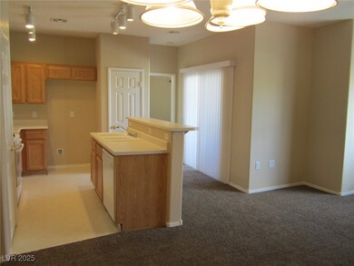 Kitchen featuring dishwasher, a sink, an island wi