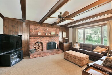 Family Room with brick fireplace, wood beamed ceil