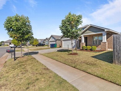 View of front of house with a front yard and a garage