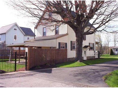 Exterior Back. Yard completely fenced/paved drive
