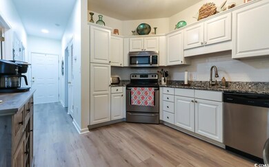Kitchen featuring light wood-type flooring, sink, 