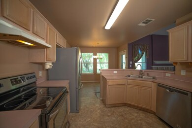 Kitchen with appliances with stainless steel finis