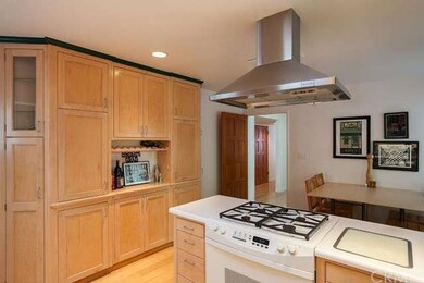 The kitchen features gas burners, built-in cutting