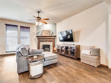 Living room featuring a fireplace, hardwood / wood