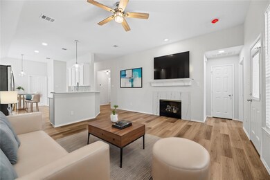 Virtually Staged_Living room with a tile fireplace