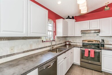 New cabinets, concrete countertops, tile backsplas
