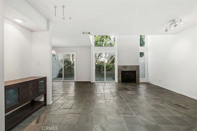 Spacious living room with fireplace and sliding doors to patio