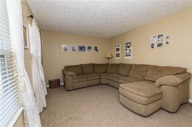To the left of the foyer is either a formal living