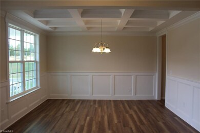 Formal Dining Room with Wainscot and Segmented Cei