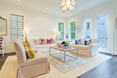 Family room with doors that open to juliet balcony