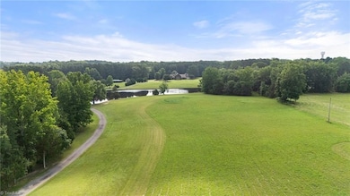 25 acres with a stocked pond.
