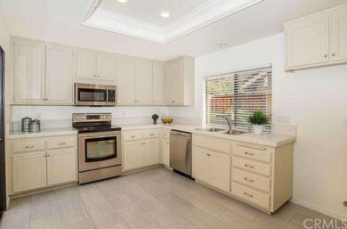 Remodeled kitchen features quartz countertops, new