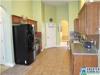 Lovely tile kitchen with granite counters, gas ran
