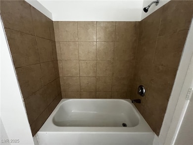 Full bathroom with shower / washtub combination