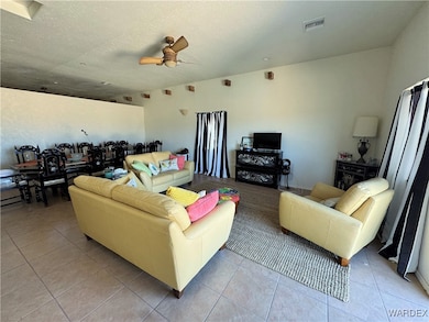 Living area featuring light tile patterned floors,