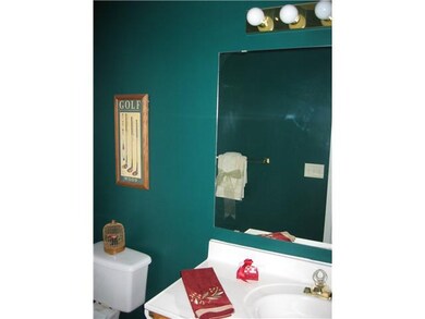 Bathroom. The powder room is situated off the entr