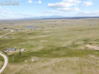 Birds eye view of property featuring a rural view