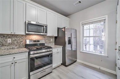 Kitchen with appliances with stainless steel finis