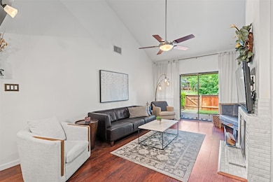 Living area featuring ceiling fan, wood finished 