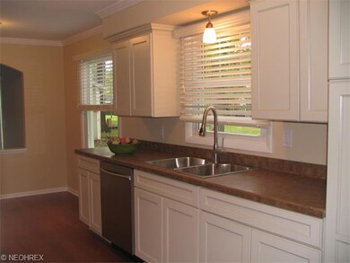 Kitchen with new cabinets, countertops, flooring, 