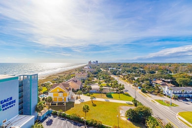 Drone / aerial view with a water view and a beach 