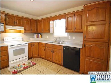 Kitchen w/ lots of cabinets, built-in microwave an