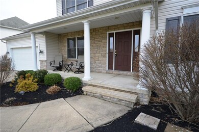 Welcoming front porch with very nice landscaping