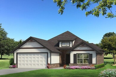 View of front of property featuring a front yard, driveway, and brick siding