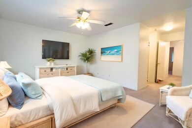 Virtually Staged Primary bedroom with ceiling fan.