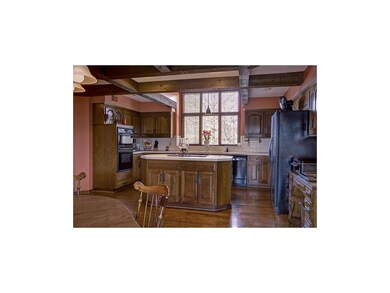 Hardwood floors gleam in the hub of the home.