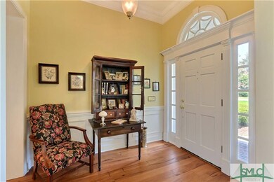 Stunning Foyer Entrance with Wainscoting and Sidel