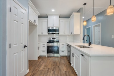 Kitchen featuring appliances with stainless steel